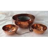 Copper hanging bowl on chains and three other pieces