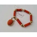 A 19TH CENTURY GOLD AND CORAL DROP BRACELET