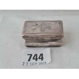 An antique continental snuff box, hinged cover engraved with trophies - 2" wide