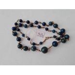 A lapis bead necklace with 9ct clasp