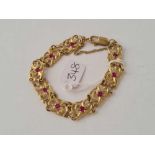 A CONTEMPORY GOLD AND RED STONE BRACELET 9CT - 17.1 GMS