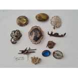 Eleven silver brooches - 54 gms