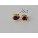 Pair of 9ct fancy amethyst earrings 1.3g inc