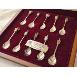 Good cased set of "The Queens Beasts " spoons with enamel decoration. Birmingham 1952. 470gms