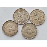 Four better grade George VI silver shillings