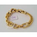 A designer multi link bracelet in yellow metal 8 inches - 30.6 gms