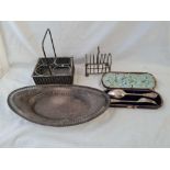 A boat shaped bread dish , toastrack etc