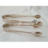 A pair of George III bright cut sugar tongs, London 1804 & another pair later, total w.68g