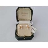 A pair of attractive triple pearl cluster earrings 18ct gold