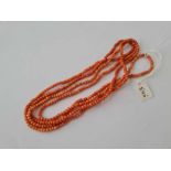 A OPERA LENGTH CORAL BEAD NECKLACE 50 INCHES