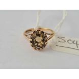 A large yellow stone dress ring 9ct size K1.2 - 2.1 gms