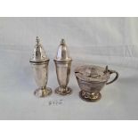 A three piece cruet set with panelled sides - Sheffield 1958 - 160 g. excluding liner