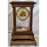 A decorative brass mantel clock by Mason of Paris with paste decorated dial and pendulum. With