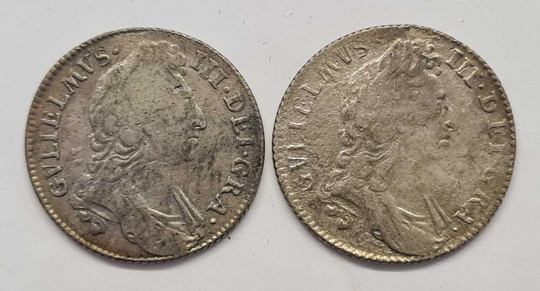 Two William III shillings.