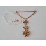 A unusual tie pin/brooch with two high carat gold cantinelle filagree Maltese cross pendants with