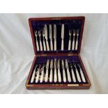 A boxed set of twelve fruit knives and forks with MOP handles - Sheffield 1911 by GH (some damaged)