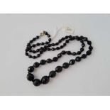 A graduate black jet faceted necklace