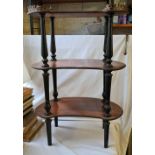 A three tier kidney shaped etagere with brass gallery mount