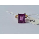 A rectangular purple stone 10k dress ring size J 4g