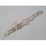 A silver coin bracelet consisting of seven rare Cuban coins