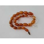 A string of graduated amber beads - 35gms