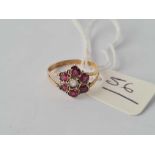 A Victorian gold garnet cluster ring hallmarked for 1857 size K