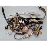 A bag of assorted gents and ladies wrist watches