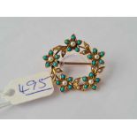 A pretty oval turquoise and pearl brooch in 9ct/18ct gold - 4.5 gms