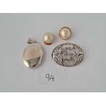 A silver locket, brooch and earrings