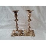 A pair of 18th Century style large candlesticks with shell decorated bases, detachable nozzles -