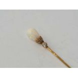 A Victorian high carat gold opal and diamond stick pin