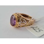 Purple stone 14ct gold ring with pierced shank