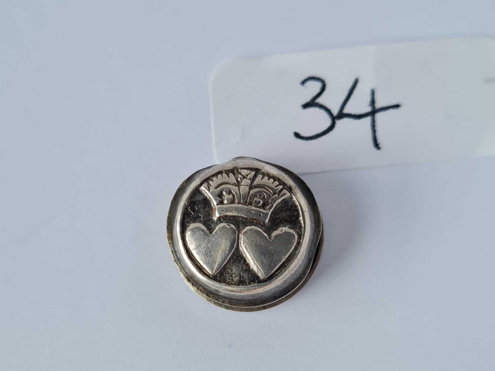 An antique silver stud with double heart and crown motif marked T A