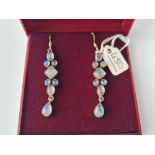 A attractive pair of silver moonstone drop earrings 6cm