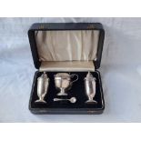 A boxed three piece cruet set on pedestal foot - 137 g. excluding BGL