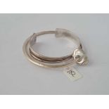 A silver designer bangle and a silver torque bangle 42g