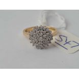 A diamond cluster ring 18ct gold size N - 4.2 gms