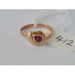A snake ring with ruby and single diamond eye set in high carat gold size N - 2.4 gms