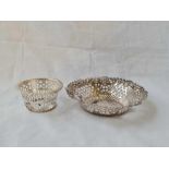 A circular pierced dish - 4.5" wide - and a small pierced bowl - 52 g.