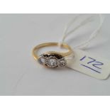 A good three stone diamond twist ring 18ct gold size J1/2 - 2.4 gms