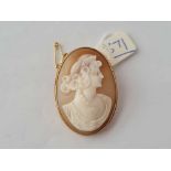 A mounted oval cameo of a lady set in 9ct