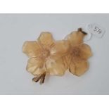 A large 9cm long horn flower brooch