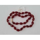 A string of red amber beads