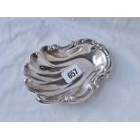 A sterling silver dish with scroll rim - 5.5" wide - 65 g.