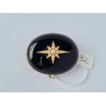 A gold onyx & pearl memorial brooch engraved 1877 with name to reverse 27g inc