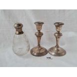 A pair of candle sticks with reeded rims, B'ham 1915 & a silver mounted jar with glass body