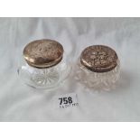 Two silver top jars, one embossed with angel's heads, glass bodies - one Birmingham 1919