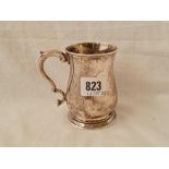 An early George III half pint mug with leaf capped double scroll handle - London 1760 by script