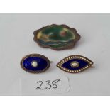 Three silver and enamel brooches