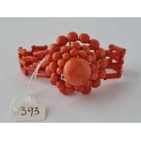 A CORAL GATE BRACELET WITH LARGE CORAL BEAD BALLS EYE CLASP ONE CORAL BEAD MISSING - 33 GMS